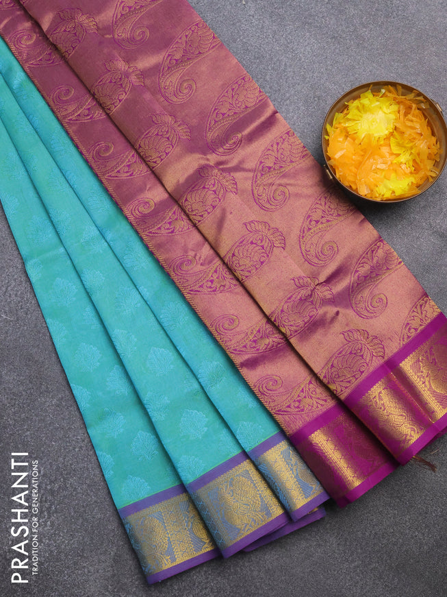 Silk cotton saree dual shade of teal green shade and purple with allover self emboss & jacquard and annam zari woven border