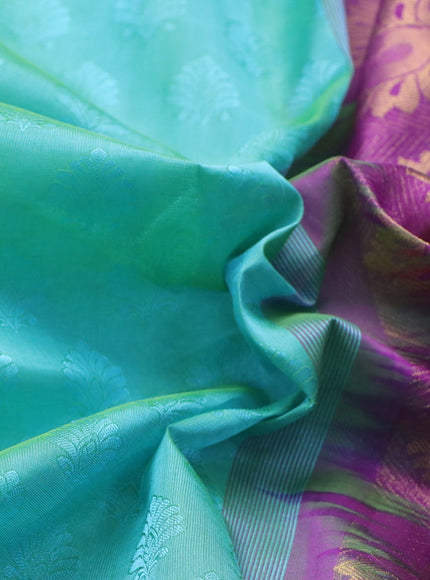 Silk cotton saree dual shade of teal green shade and purple with allover self emboss & jacquard and annam zari woven border