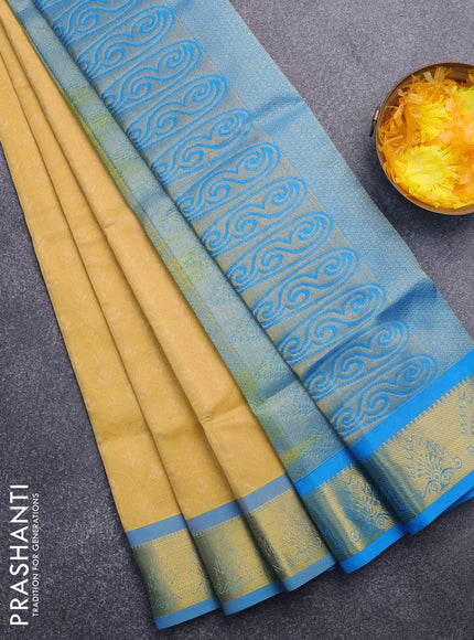 Silk cotton saree yellow and cs blue with allover self emboss & jacquard and zari woven border