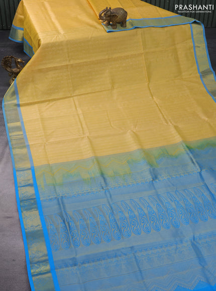 Silk cotton saree yellow and cs blue with allover self emboss & jacquard and zari woven border