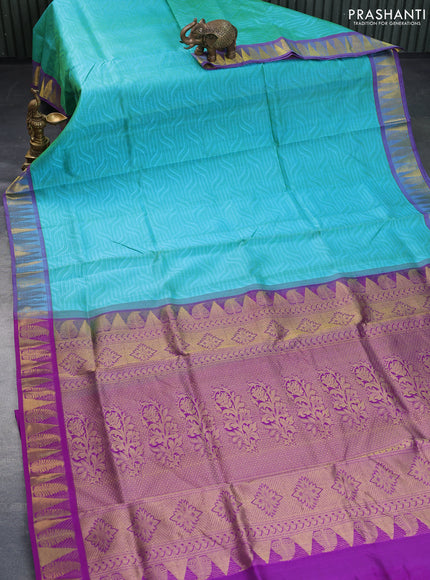 Silk cotton saree dual shade of teal bluish green and purple with allover self emboss & jacquard and zari woven border