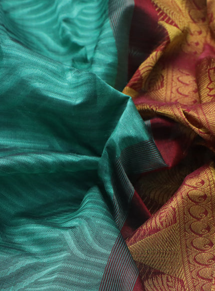 Silk cotton saree green shade and maroon with allover self emboss & jacquard and zari woven border