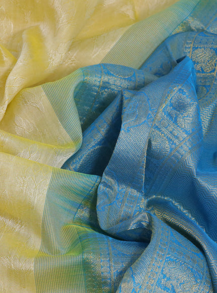 Silk cotton saree pale yellow and cs blue with allover self emboss & jacquard and annam & rudhraksha zari woven border