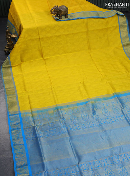 Silk cotton saree mango yellow and cs blue with allover self emboss & jacquard and annam & rudhraksha zari woven border