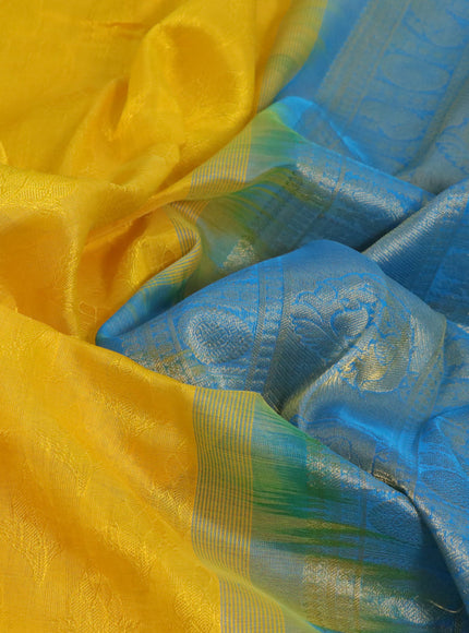 Silk cotton saree mango yellow and cs blue with allover self emboss & jacquard and annam & rudhraksha zari woven border