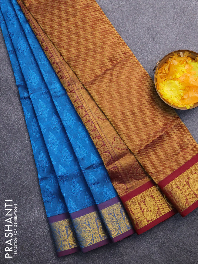 Silk cotton saree cs blue and maroon with allover self emboss & jacquard and annam & rudhraksha zari woven border