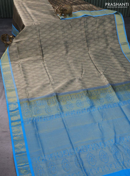 Silk cotton saree beige and cs blue with allover self emboss & jacquard and annam & rudhraksha zari woven border