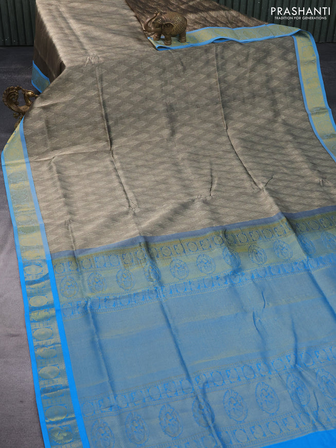 Silk cotton saree beige and cs blue with allover self emboss & jacquard and annam & rudhraksha zari woven border