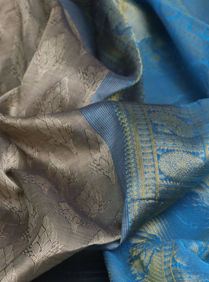 Silk cotton saree beige and cs blue with allover self emboss & jacquard and annam & rudhraksha zari woven border