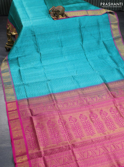 Silk cotton saree teal green and pink with allover self emboss & jacquard and zari woven border