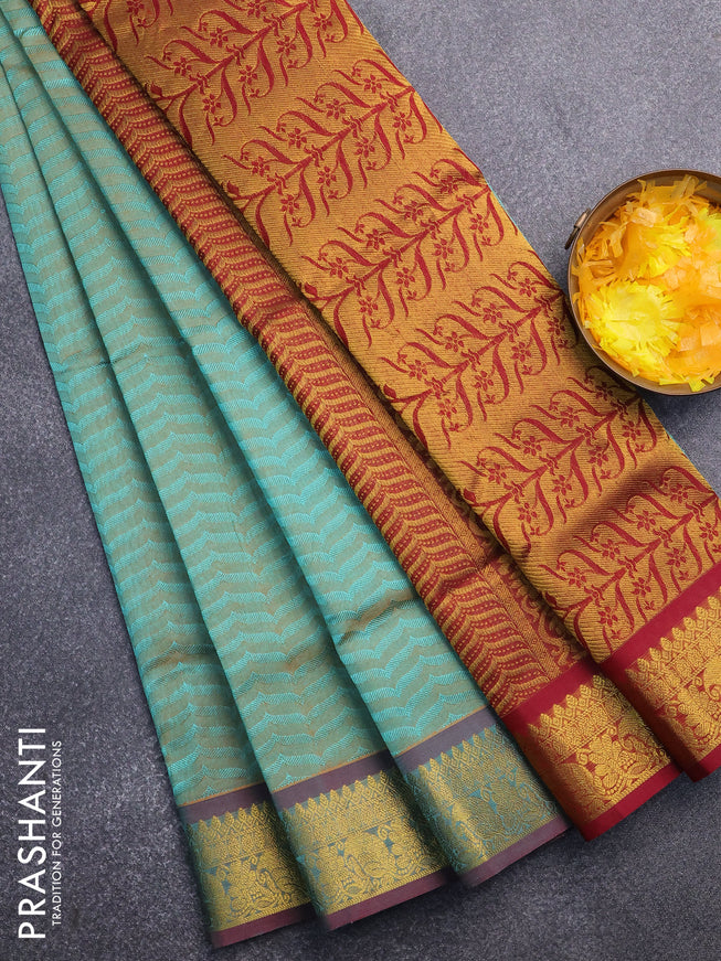 Silk cotton saree dual shade of teal green and maroon with allover self emboss & jacquard and zari woven border