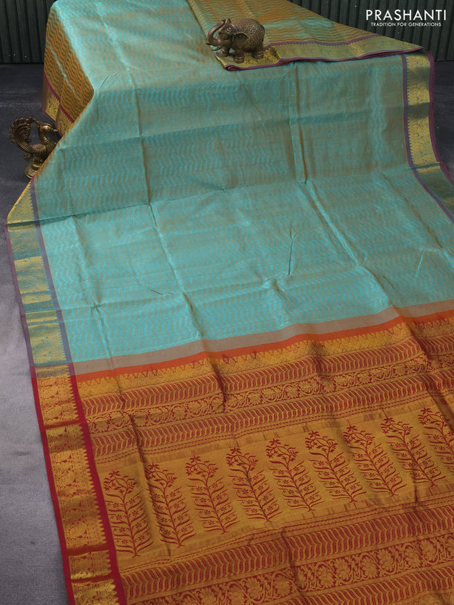 Silk cotton saree dual shade of teal green and maroon with allover self emboss & jacquard and zari woven border