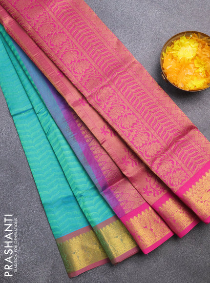 Silk cotton saree dual shade of teal green and pink with allover self emboss & jacquard and zari woven border