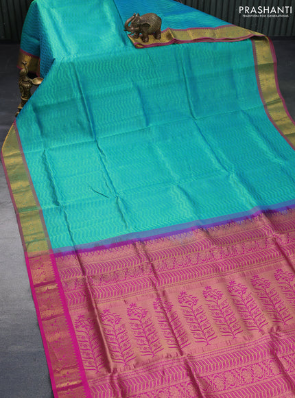 Silk cotton saree dual shade of teal green and pink with allover self emboss & jacquard and zari woven border