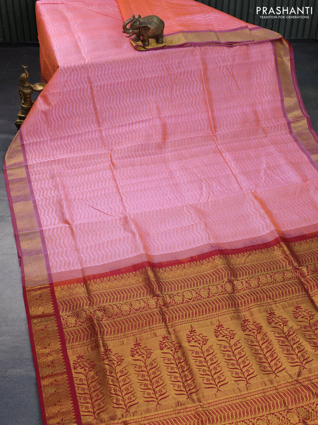 Silk cotton saree dual shade of peach orange and maroon with allover self emboss & jacquard and zari woven border