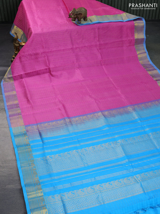 Silk cotton saree light pink and light blue with allover zari checks & buttas and annam & rudhraksha zari woven border