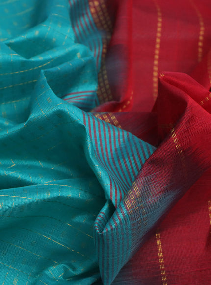 Silk cotton saree teal blue and red with allover zari checks & buttas and annam & rudhraksha zari woven border