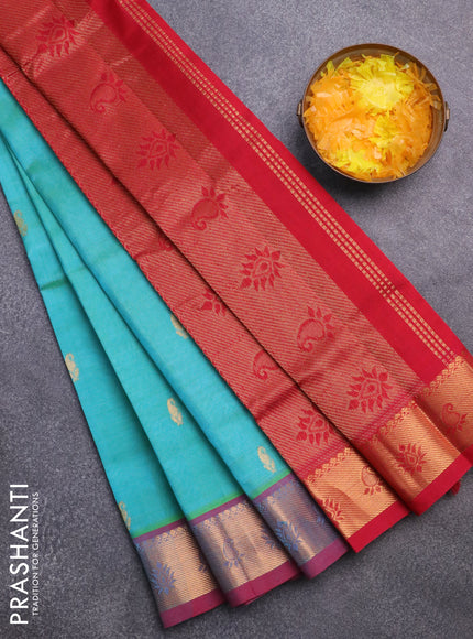 Silk cotton saree dual shade of teal bluish green and kumkum red with paisley zari woven buttas and rich zari woven border