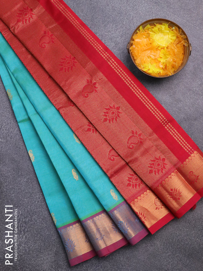 Silk cotton saree dual shade of teal bluish green and kumkum red with paisley zari woven buttas and rich zari woven border