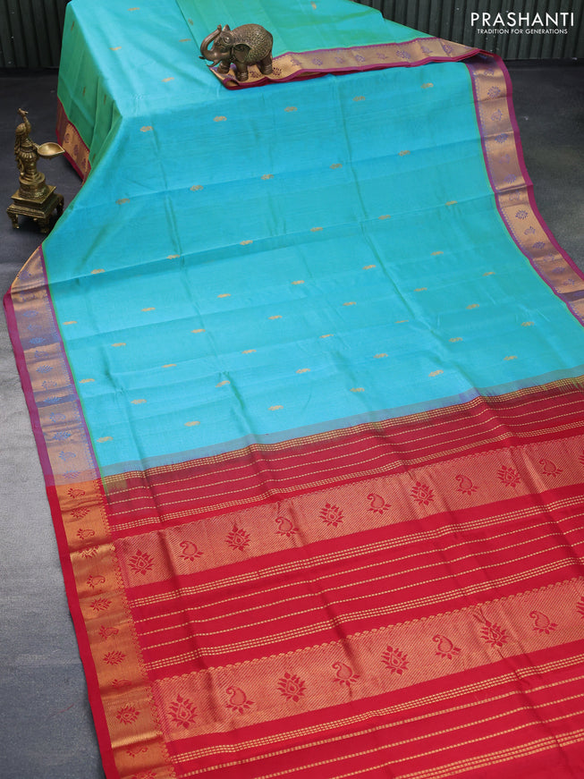 Silk cotton saree dual shade of teal bluish green and kumkum red with paisley zari woven buttas and rich zari woven border