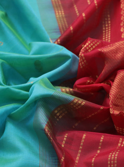 Silk cotton saree dual shade of teal bluish green and kumkum red with paisley zari woven buttas and rich zari woven border