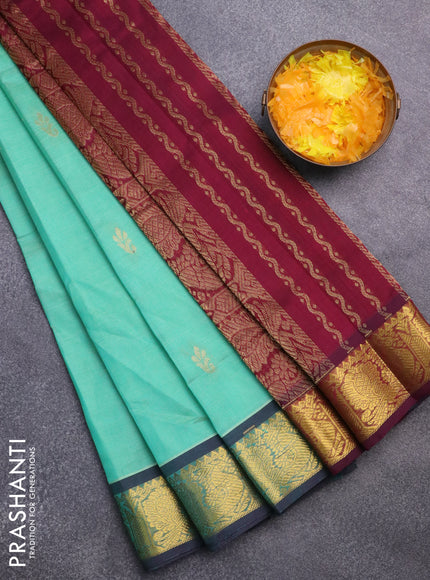 Silk cotton saree teal green and wine shade with zari woven buttas and annam zari woven border