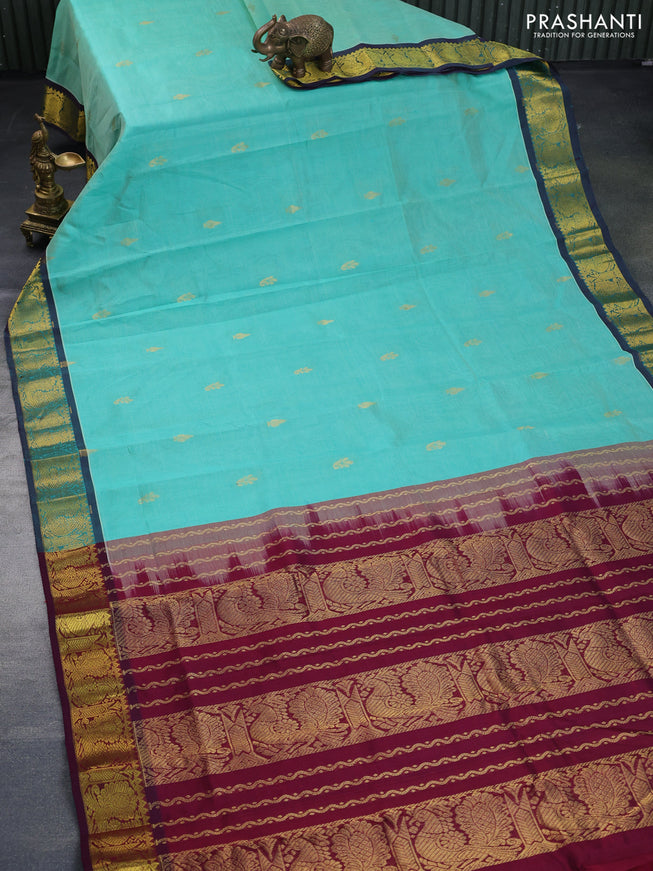 Silk cotton saree teal green and wine shade with zari woven buttas and annam zari woven border