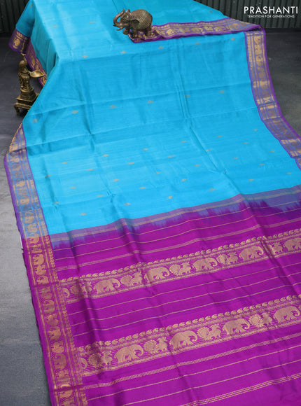 Silk cotton saree teal blue and purple with zari woven buttas and annam & elephant zari woven border