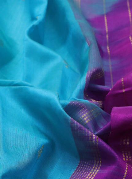 Silk cotton saree teal blue and purple with zari woven buttas and annam & elephant zari woven border