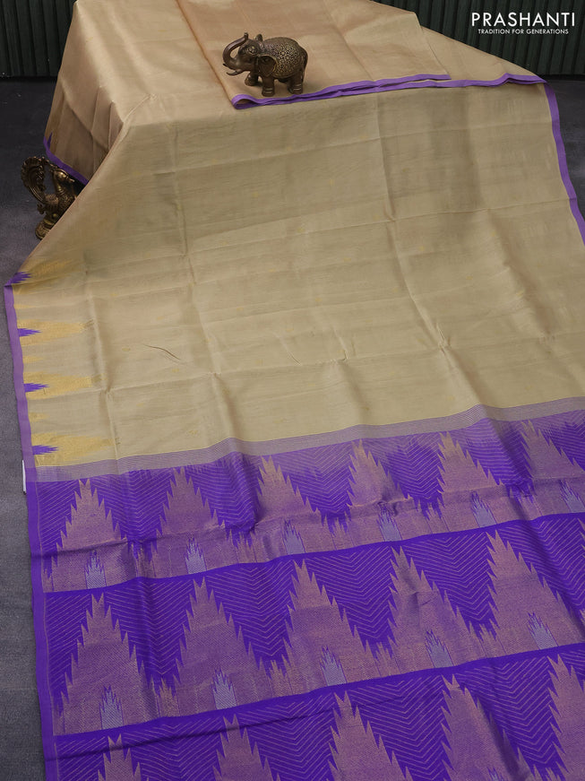 Silk cotton saree beige and violet shade with zari woven buttas and zari woven temple design border