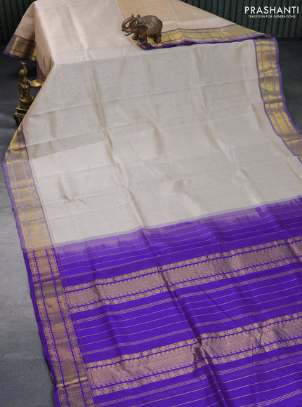 Silk cotton saree cream and blue with allover vairaosi pattern and rudhraksha zari woven border