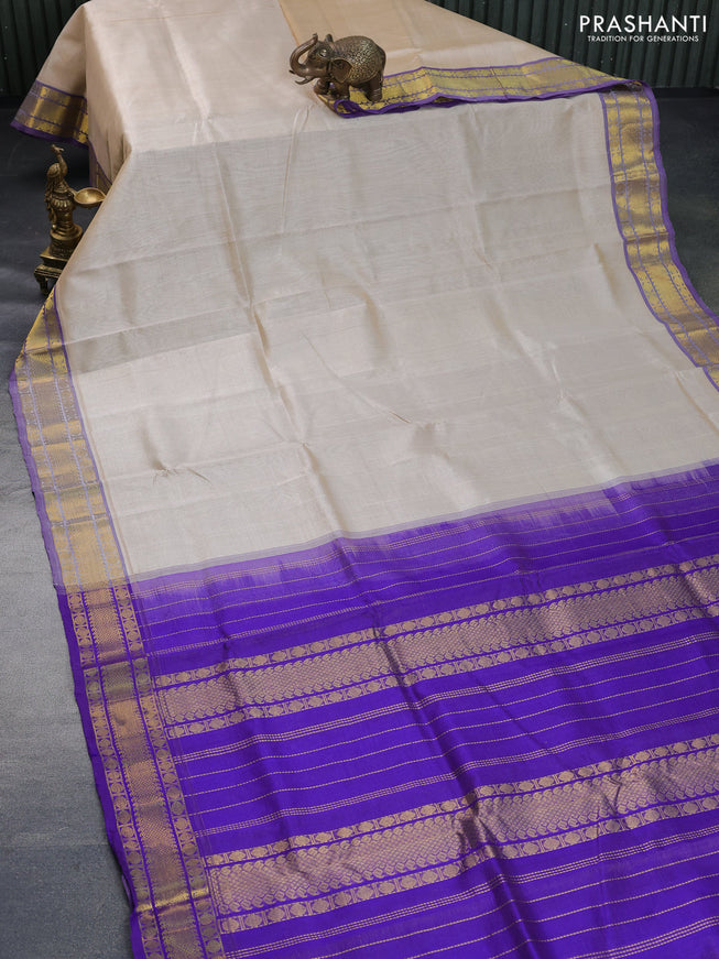 Silk cotton saree cream and blue with allover vairaosi pattern and rudhraksha zari woven border