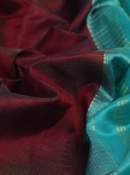 Silk cotton saree deep maroon and teal blue with allover vairaosi pattern and annam & elephant & zari woven border