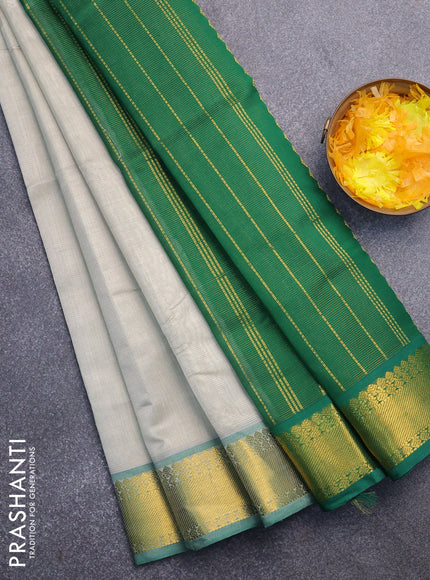 Silk cotton saree grey shade and green with allover vairaosi pattern and zari woven border