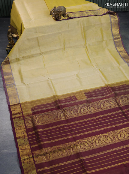 Silk cotton saree pale yellow shade and wine shade with allover vairaosi pattern and annam zari woven border