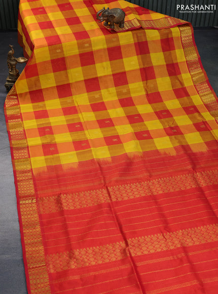 Silk cotton saree yellow and red with allover paalum pazhamum checks & zari buttas and rich zari woven border