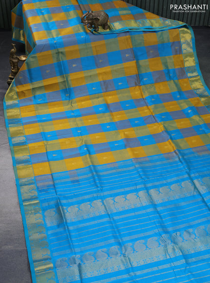 Silk cotton saree mustard yellow and teal blue shade with allover paalum pazhamum checks & zari buttas and paisley zari woven border