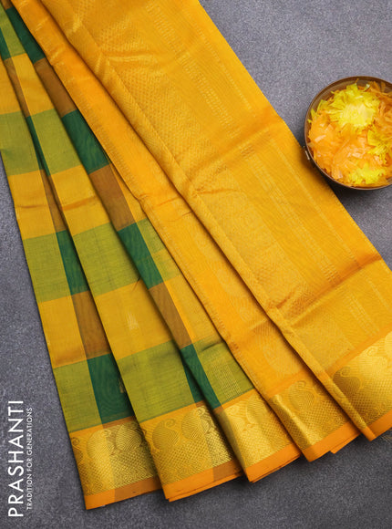 Silk cotton saree green and mango yellow with allover paalum pazhamum checks & zari buttas and paisley zari woven border