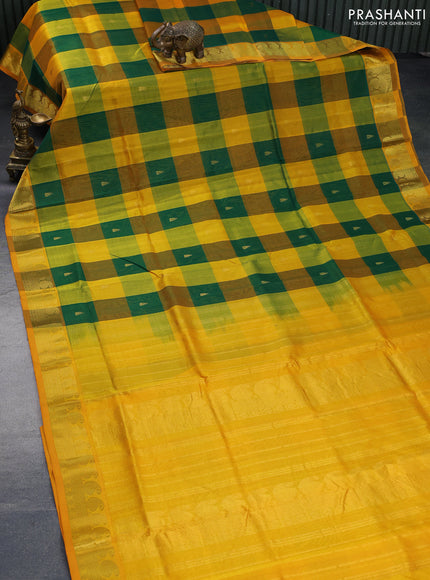 Silk cotton saree green and mango yellow with allover paalum pazhamum checks & zari buttas and paisley zari woven border