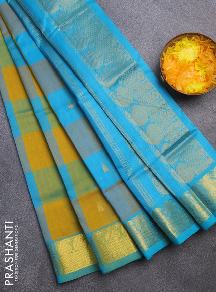 Silk cotton saree mustard yellow and teal blue with allover paalum pazhamum checks & zari buttas and paisley zari woven border