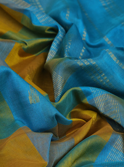 Silk cotton saree mustard yellow and teal blue with allover paalum pazhamum checks & zari buttas and paisley zari woven border