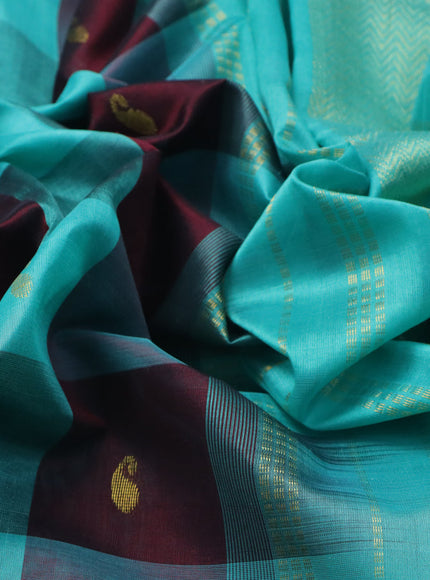 Silk cotton saree deep maroon and teal blue with allover paalum pazhamum checks & zari buttas and zari woven border