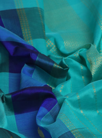 Silk cotton saree blue and teal blue with allover paalum pazhamum checks & zari buttas and zari woven border