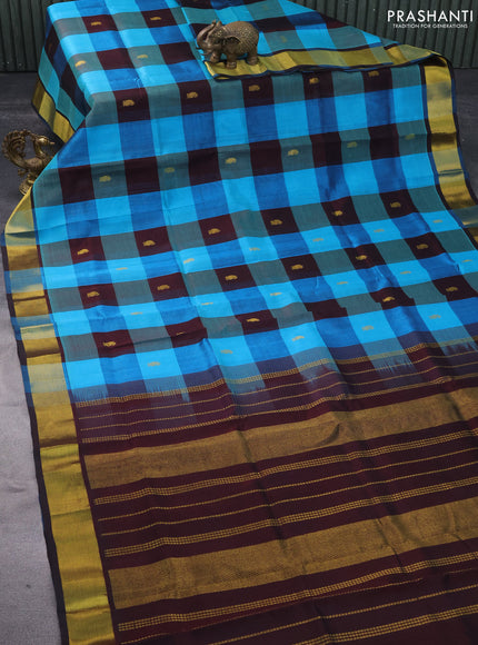 Silk cotton saree cs blue and deep coffee brown with allover paalum pazhamum checks & zari buttas and zari woven border