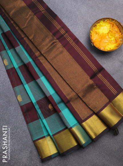 Silk cotton saree teal blue and deep brown with allover paalum pazhamum checks & zari buttas and zari woven border