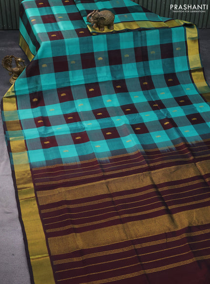 Silk cotton saree teal blue and deep brown with allover paalum pazhamum checks & zari buttas and zari woven border