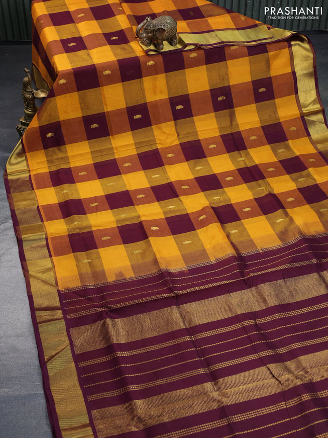 Silk cotton saree mustard yellow and wine shade with allover paalum pazhamum checks & zari buttas and zari woven border