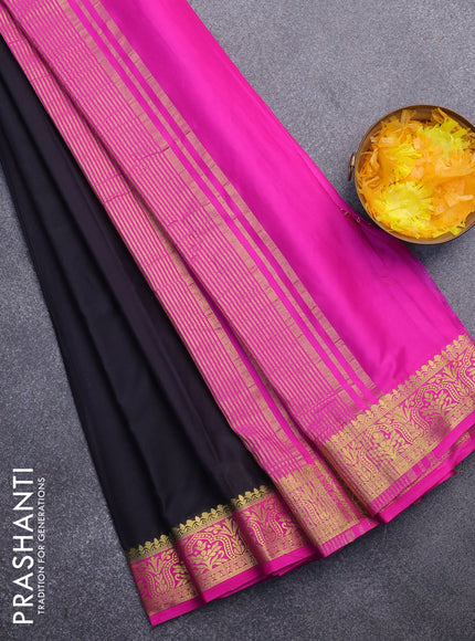 Semi crepe saree black and pink with plain body and zari woven border