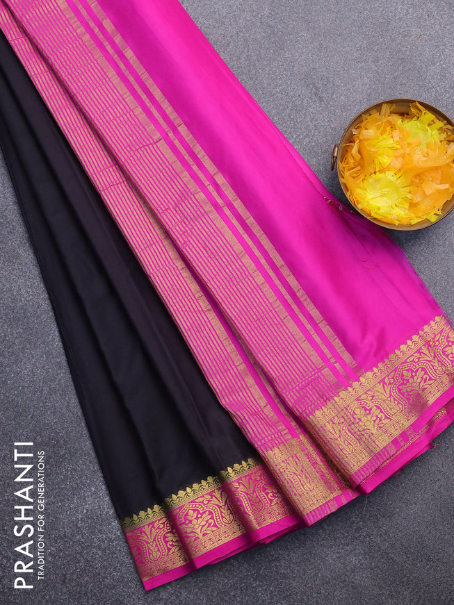 Semi crepe saree black and pink with plain body and zari woven border