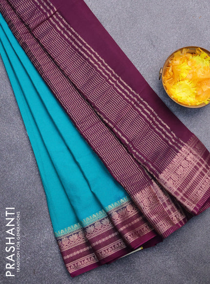 Semi crepe saree teal green shade and deep purple with plain body and zari woven border